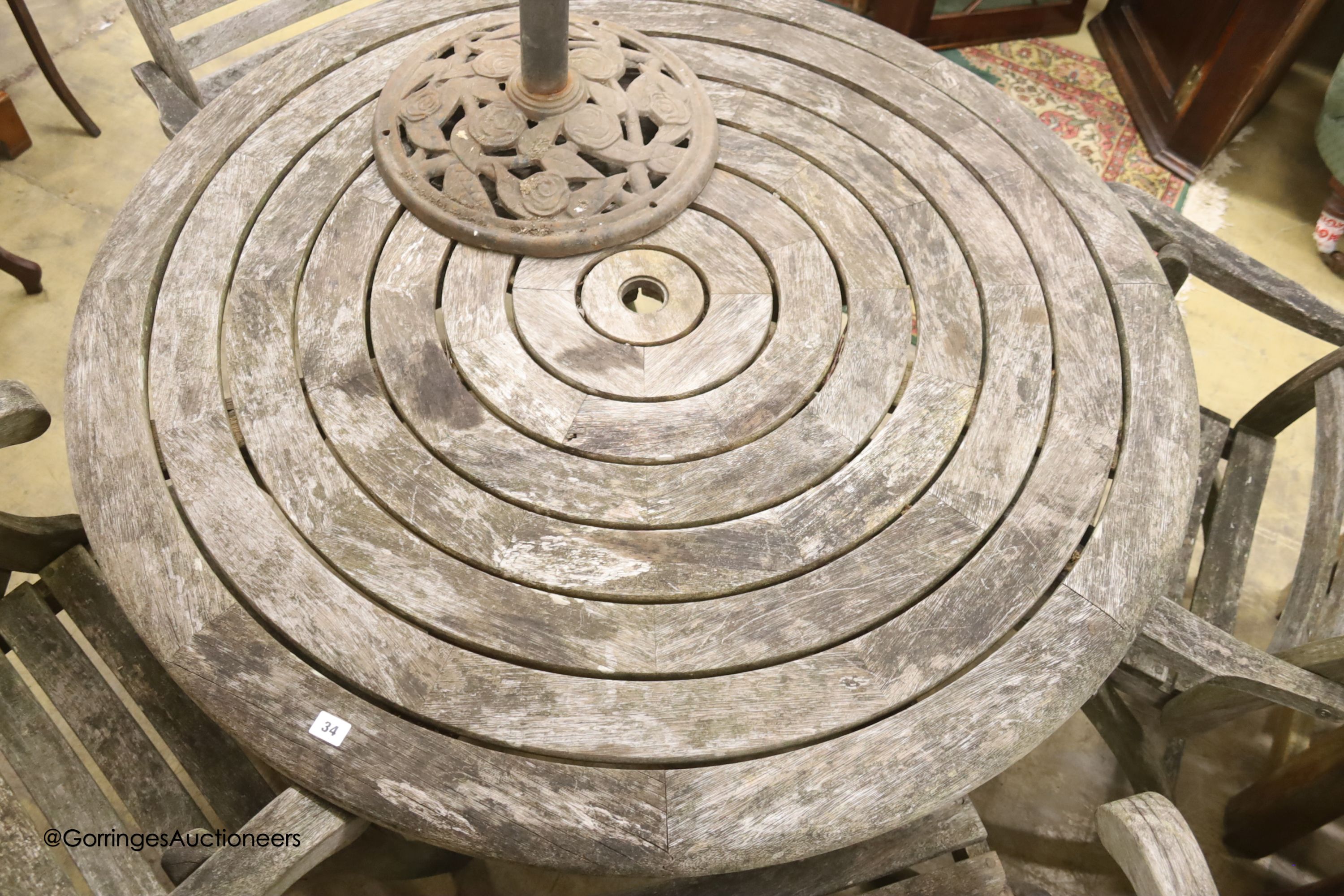 Alexander Rose weathered teak circular garden table, diameter 180cm, height 100cm and four folding elbow chairs